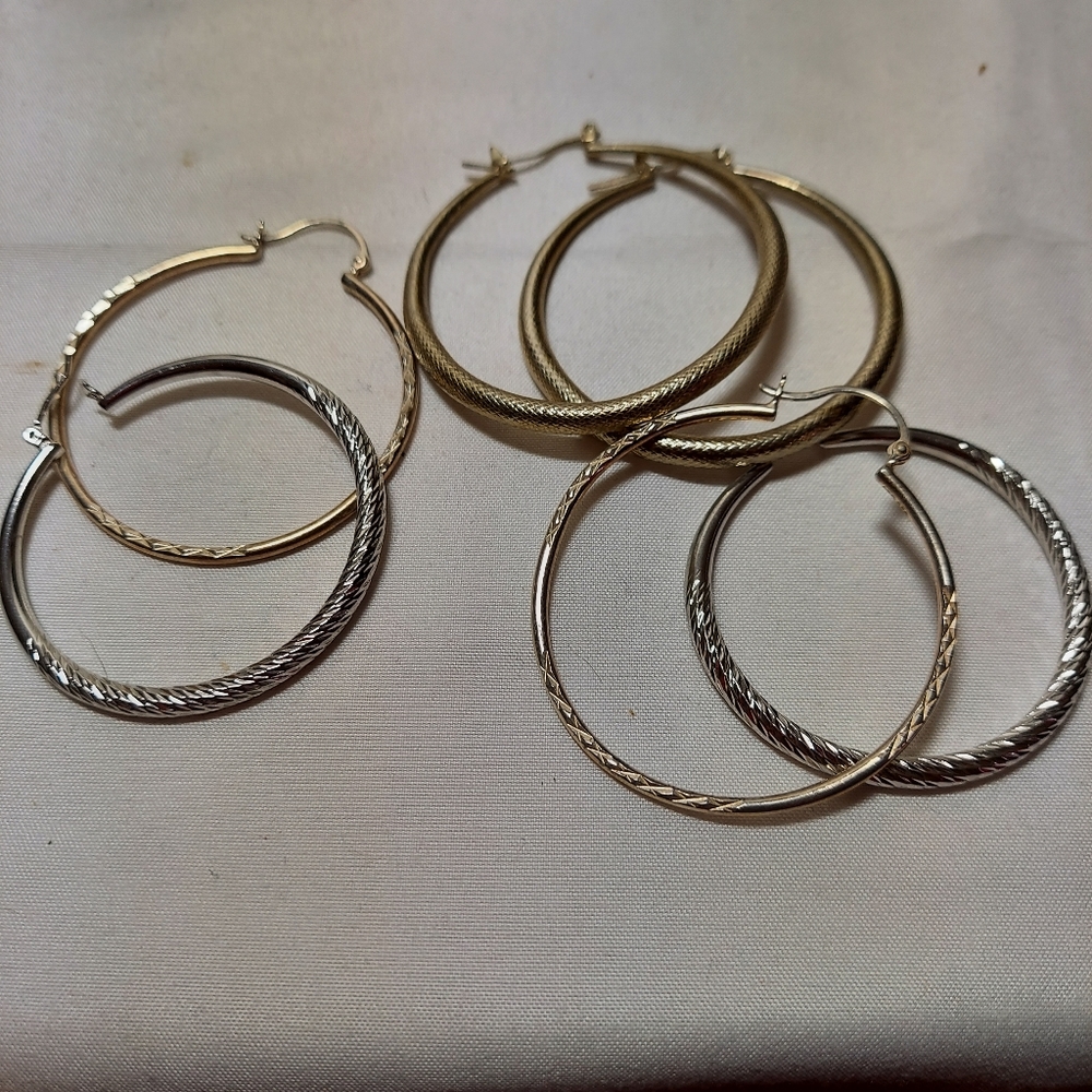 3 pair Silver tone  hoop earrings with texture. 2" dangle round